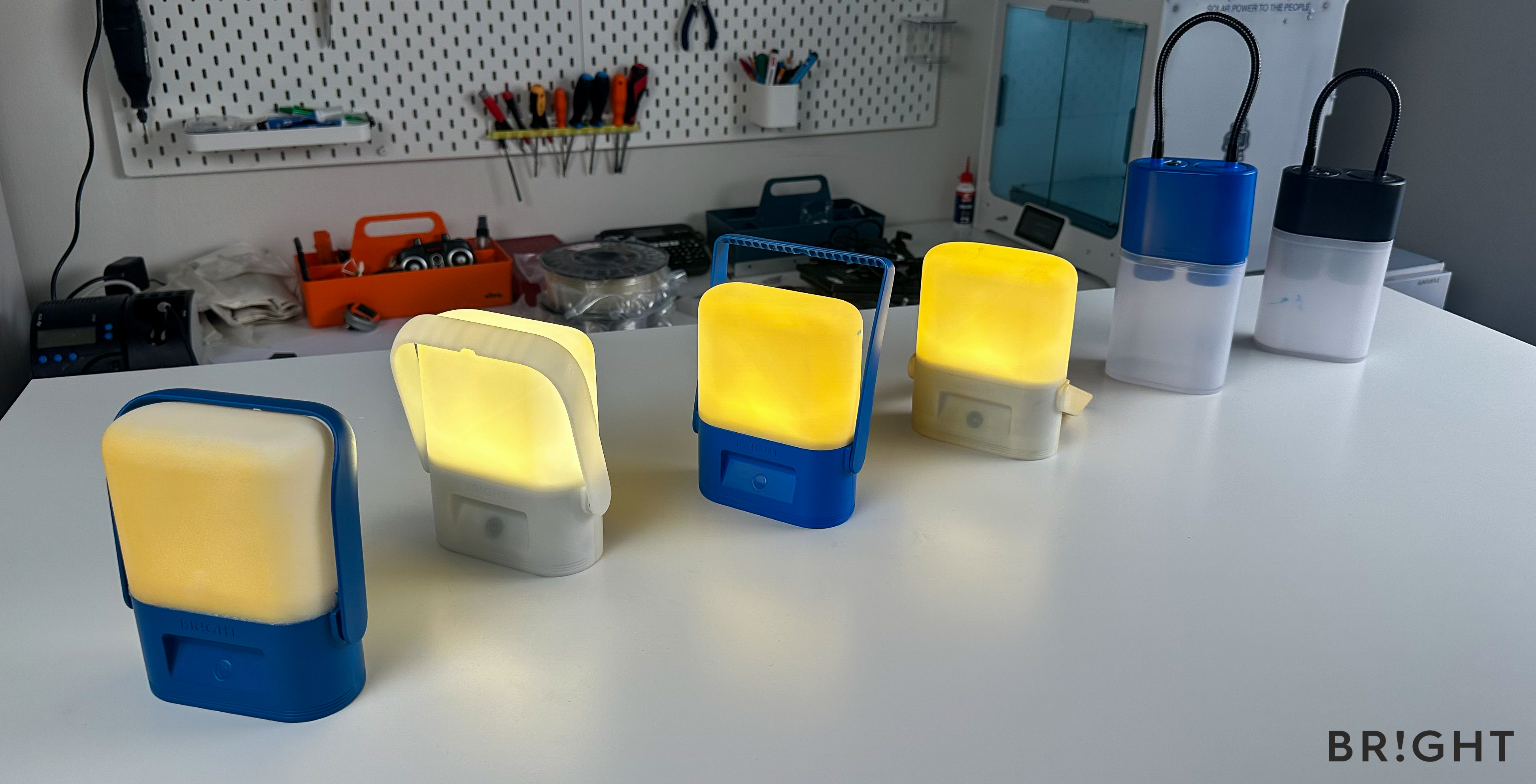 The image shows the several prototype iterations of BRIGHT's Sol solar lamp