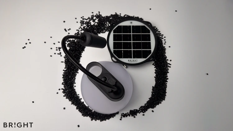 Image of upgraded SunBell 2.0Y solar lamp which features casing components made from 100% post-consumer recycled (PCR) plastic