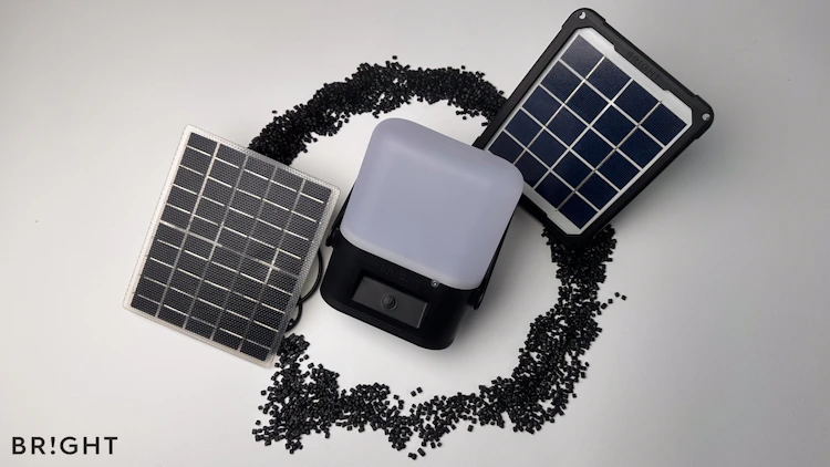 The new, lighter and more efficient monocrystalline solar panel using Ethylene Tetrafluoroethylene (ETFE) plastic for the Sol High-Capacity and So Mid-Capacity solar lamps is shown next to the older panel which has a plastic frame to protect the glass solar panel