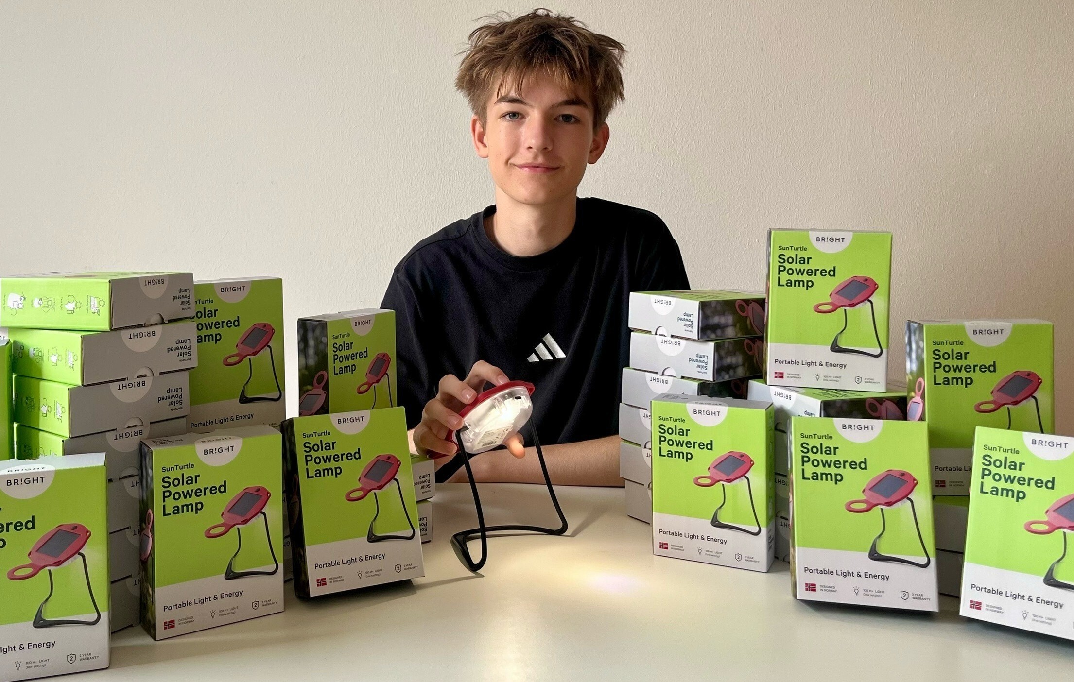 Joona Cichy sits next to some of the SunTurtle solar lamps he bought for donation to learners in Ghana and Madagascar through his Bright Futures ngo