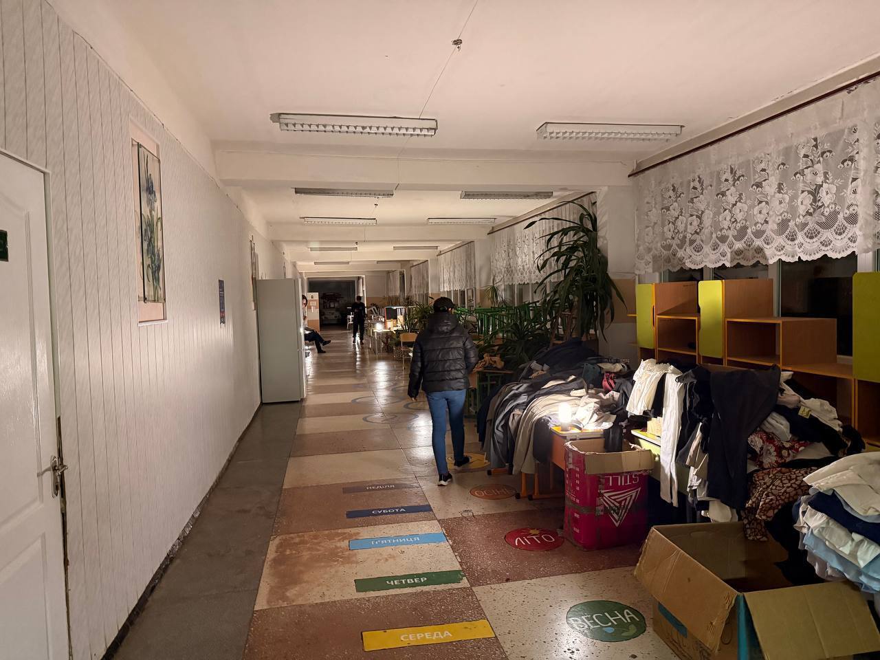 Sol solar lamps illuminate a corridor at the Lozova Transit Centre.