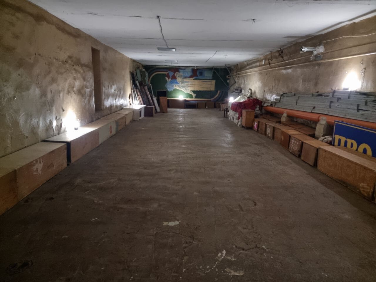 Basement bomb shelter facilities illuminated by Sol High Capacity solar lamps.