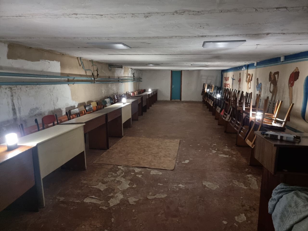 Basement bomb shelter facilities illuminated by Sol High Capacity solar lamps.